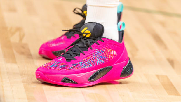 View of pink and black Jordan Luka shoes.